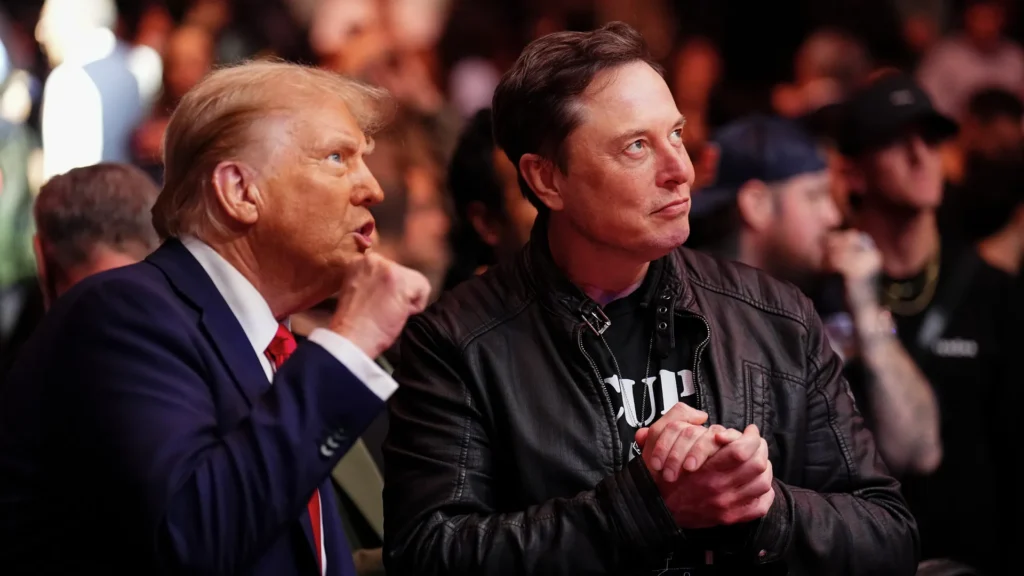 Elon Musk sits with donald trump